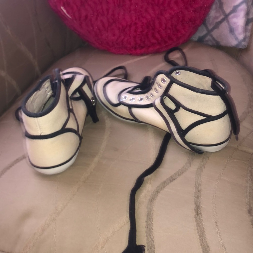 Creamy and black sneakers wish laces attached